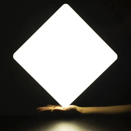 a person holding a white light in their hand