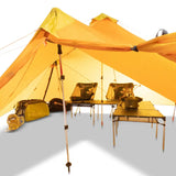 a tent with a table and chairs underneath