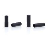 a pair of black plastic tube plugs