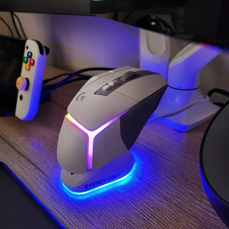 a computer mouse sitting on top of a wooden table