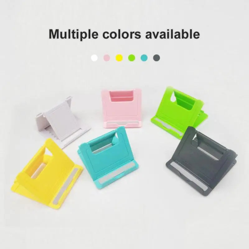 a set of four different colored plastic clips