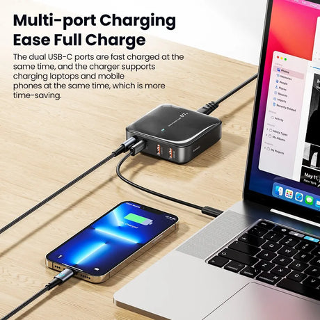 Multi-port USB-C charging hub connected to a smartphone and laptop.