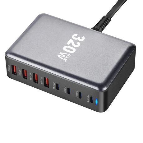 Multi-port USB charging hub with ’320W’ printed on its metallic gray surface.