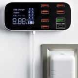 Multi-port USB charging station with digital display showing output voltage and current.