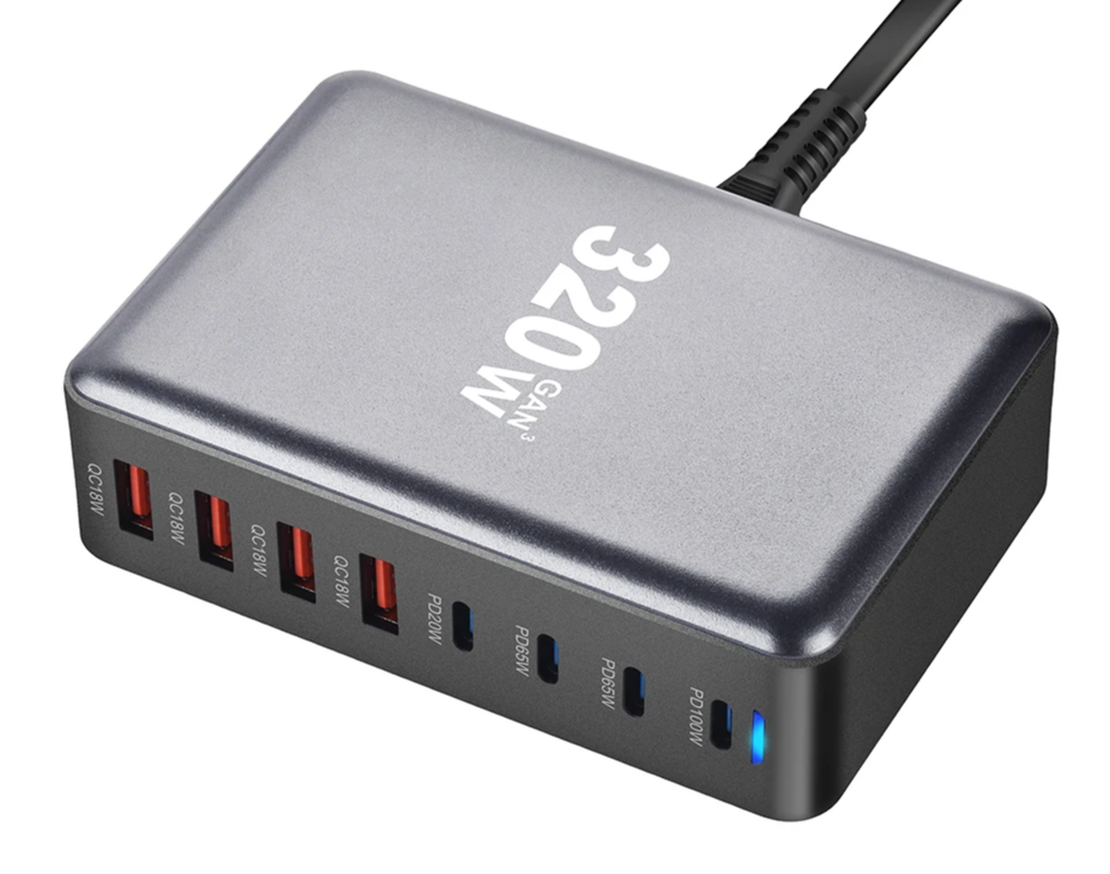Multi-port USB charging station with ’320W’ branding on its metallic gray surface.