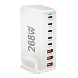 Multi-port USB charging station with various power outputs labeled on its white casing.