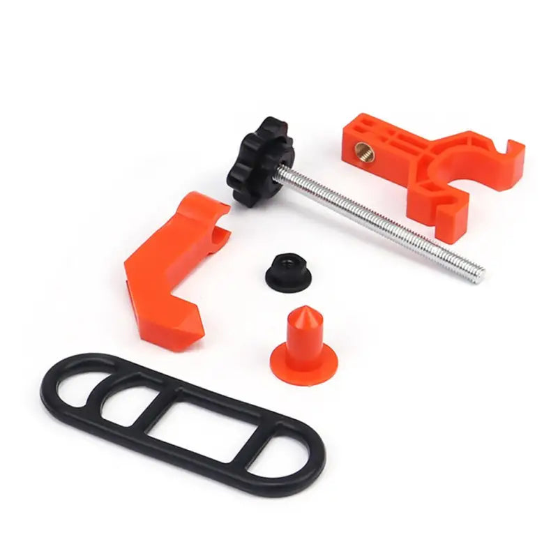 a set of orange plastic parts for a camera