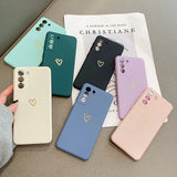 Multiple colorful silicone phone cases with a heart emblem.