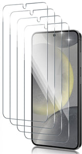 Multiple transparent screen protectors stacked in front of a smartphone.