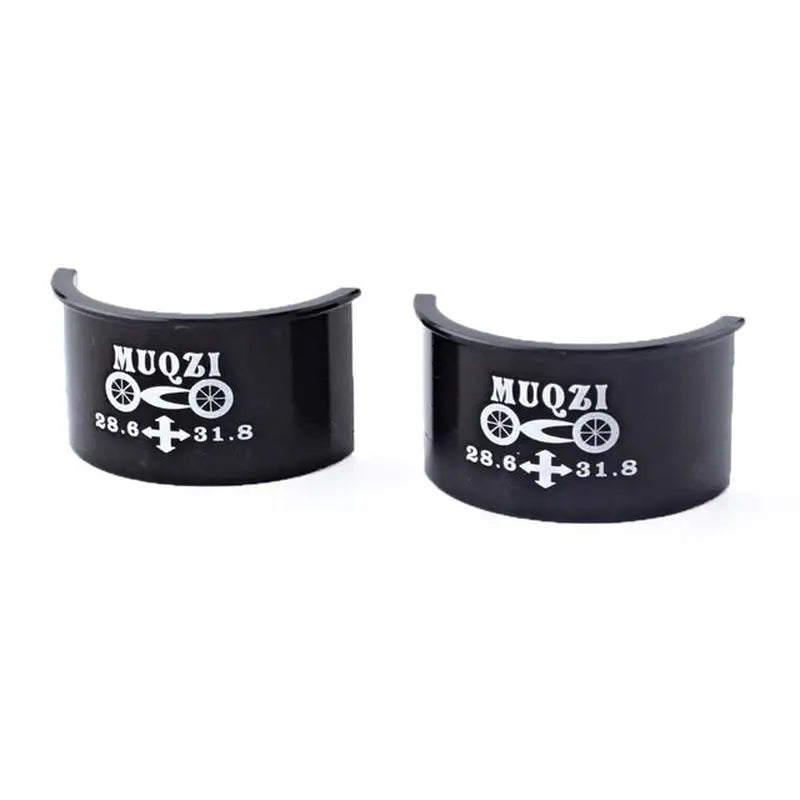 a pair of black cuff rings with the words mo on them