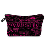 a black and pink cosmetic bag with music symbols