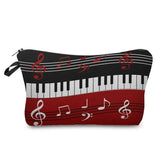 a red and black piano keyboard cosmetic bag