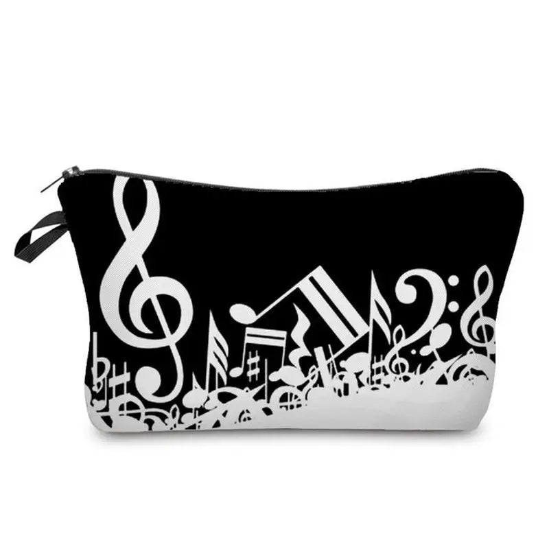 a black and white cosmetic bag with music notes