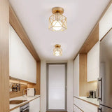 a narrow kitchen with a white and wood accent