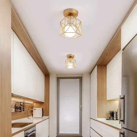 A narrow kitchen with a white and wood accent