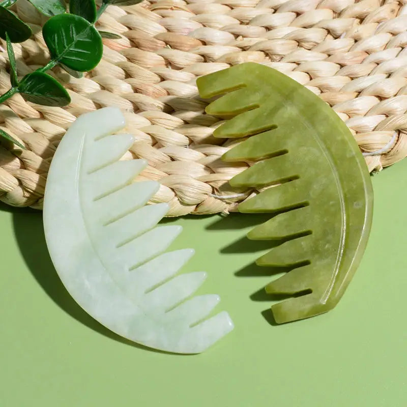 there are two pieces of green hair combs on a woven basket