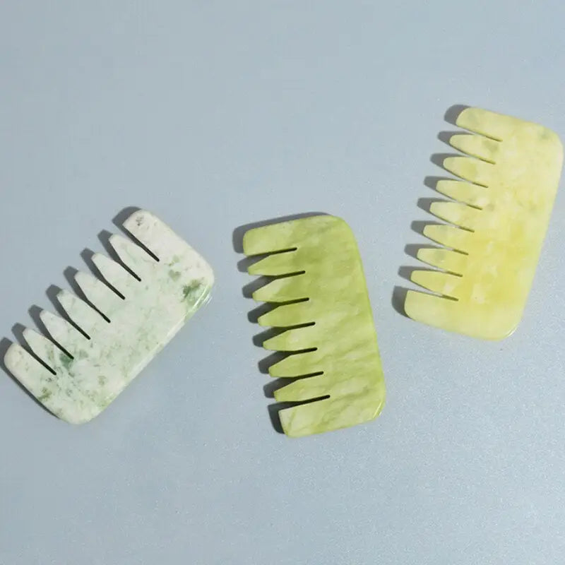 a pair of green and white hair clips