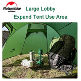 a green tent with a backpack and a cup