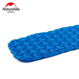 a close up of a sleeping pad with a blue cover