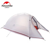 a close up of a tent with a red and white tent