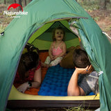a family camping in a tent