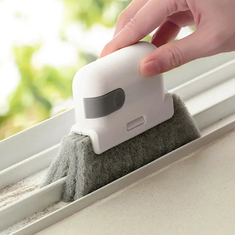 a person cleaning a window with a mop