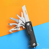 a close up of a multi tool with a black handle
