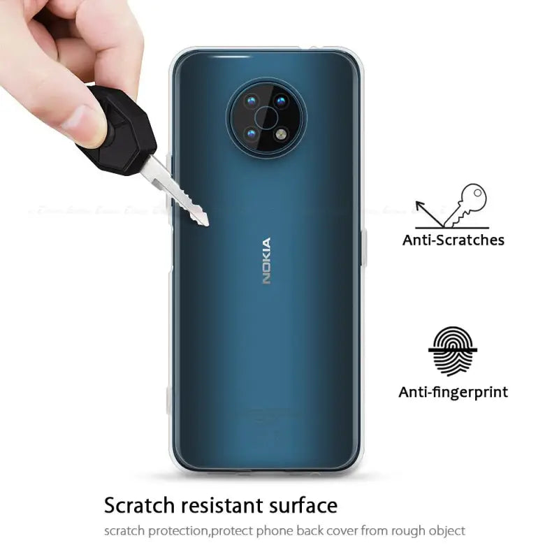 the back of a smartphone with a hand holding a key