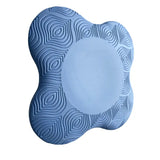 a blue foam with a circular pattern on it