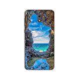 the ocean and rocks at the beach phone case