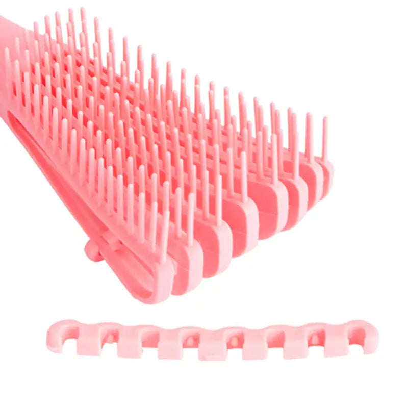 a pink plastic comb with a white background
