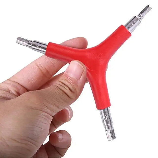 a hand holding a red and silver device