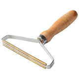 a stainless steel cheese cutter with wooden handle