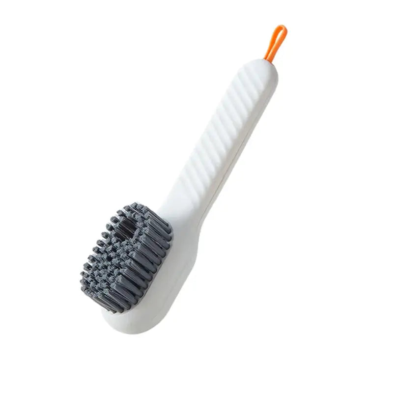 a toothbrush with a white handle and orange handle