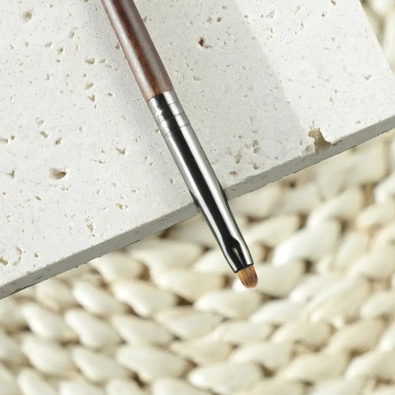 a pen on a white surface