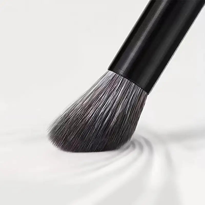 a black brush with a white background