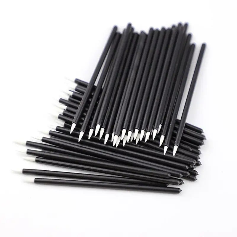 black plastic straws on a white background