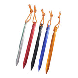three different colored plastic swords with a rope