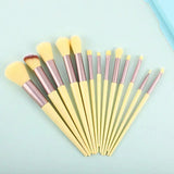 a set of makeup brushes on a blue background