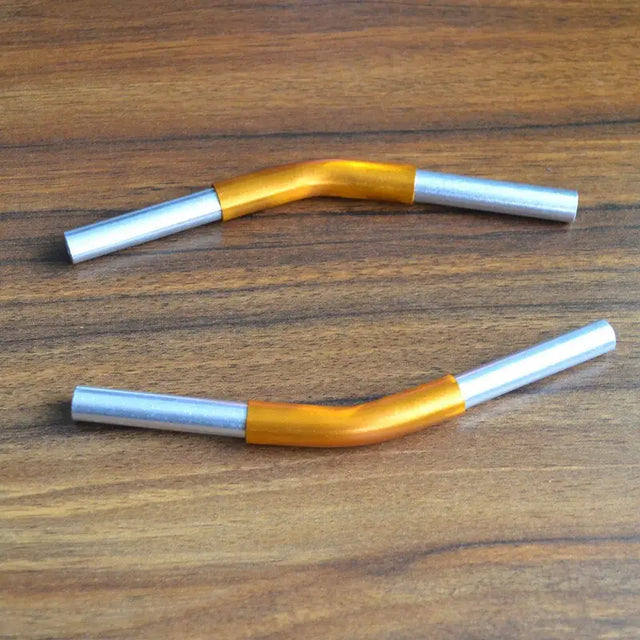a pair of orange and silver metal handles
