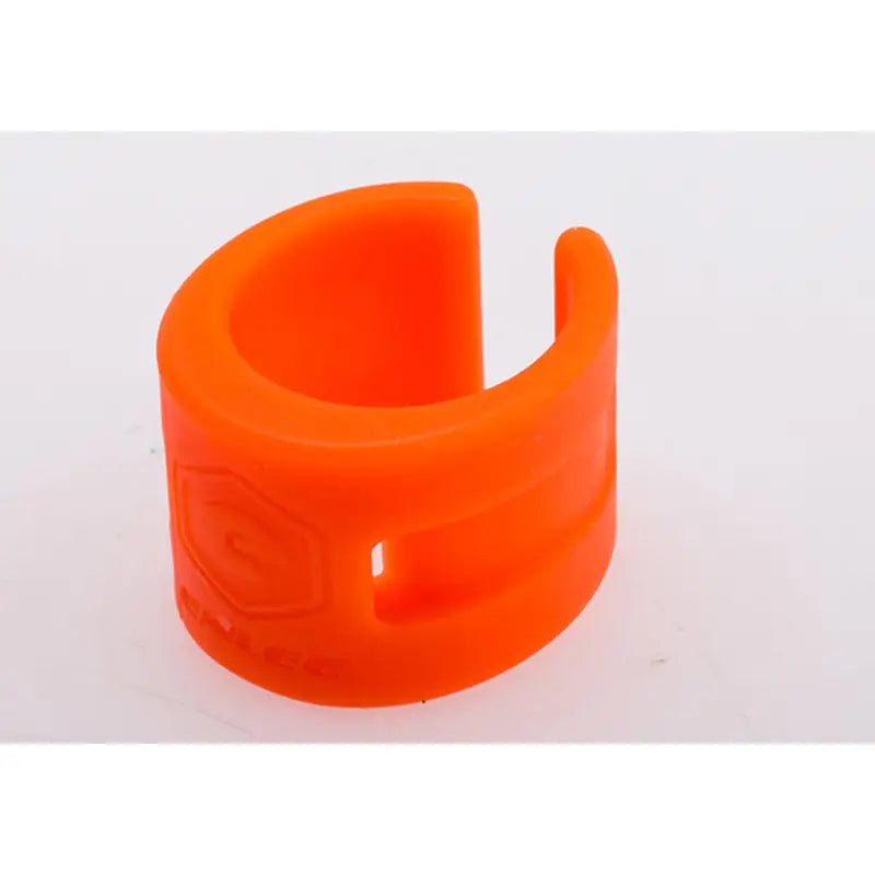 an orange plastic ring with a white background