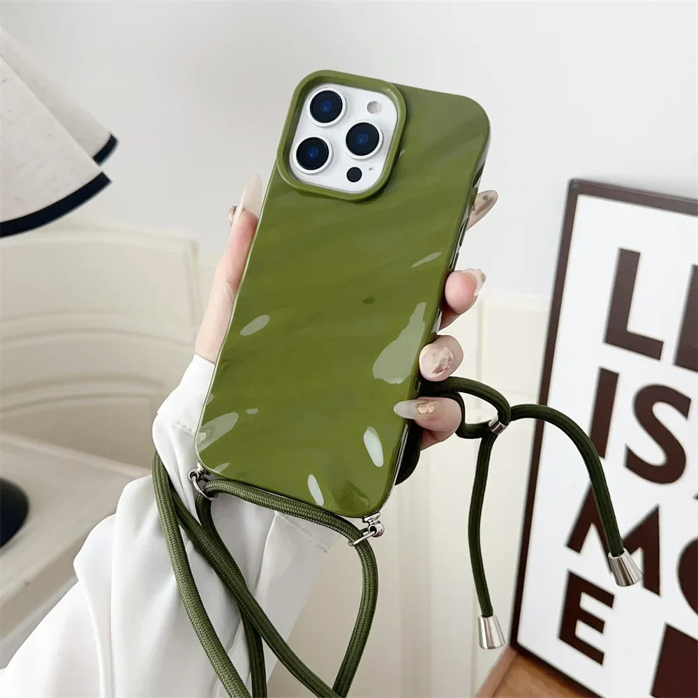 Olive green phone case with crossbody strap.