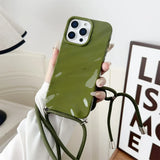 Olive green phone case with crossbody strap.