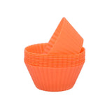 orange baking cups in a cup