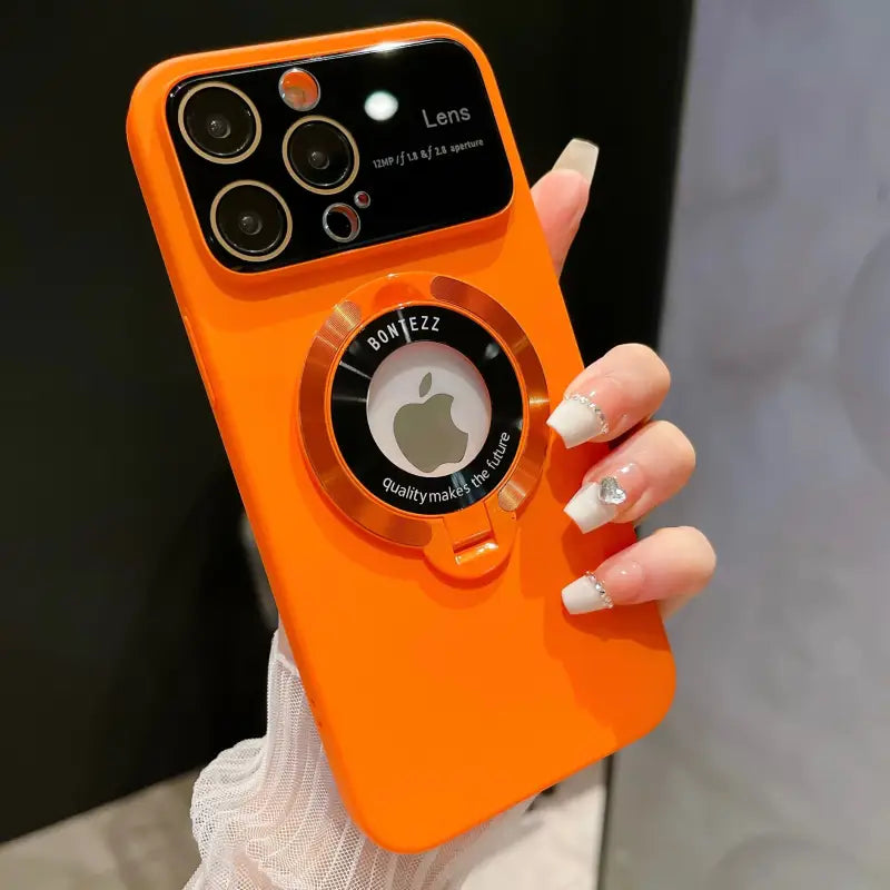 an orange iphone case with a camera attached to it