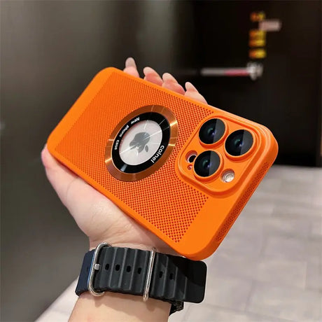 a person holding an orange iphone case