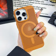 Orange iPhone case with a circular pattern and triple camera cutout.