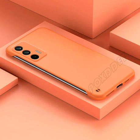 the back of an orange iphone case on a pink background