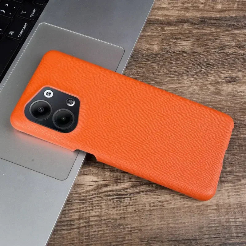 the orange leather case is on the laptop