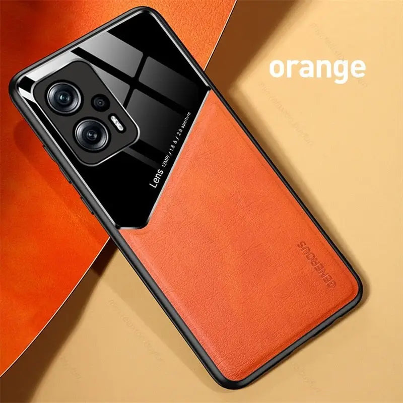 an orange leather case with a camera on it